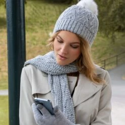 Women's Touchscreen Knitted Gloves -Dents woman wearing dove grey knitted gloves
