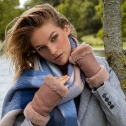 Women's Fingerless Sheepskin Mittens -Dents woman wearing honey fingerless sheepskin mittens