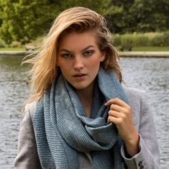 Women’s Pleated Plain Scarf With Tassels 17 Women’s Pleated Plain Scarf With Tassels -Dents woman wearing navy pleated pashmina