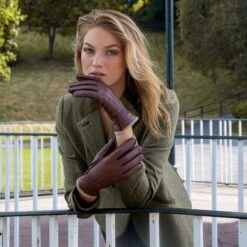 Women’s Three-Point Cashmere-Lined Deerskin Leather Gloves With Cashmere Cuffs -Dents woman wearing walnut cashmere lined deerskin gloves