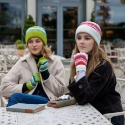 Women’s Knitted Beanie Hat With Contrasting Stripes 9 Women’s Knitted Beanie Hat With Contrasting Stripes -Dents womanwearingknittedstripehatinwhite